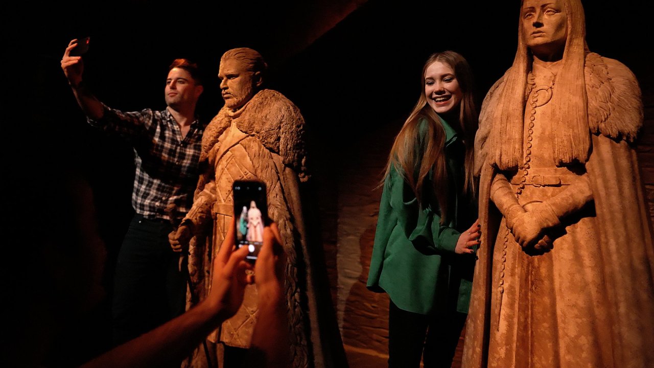 people with two statues